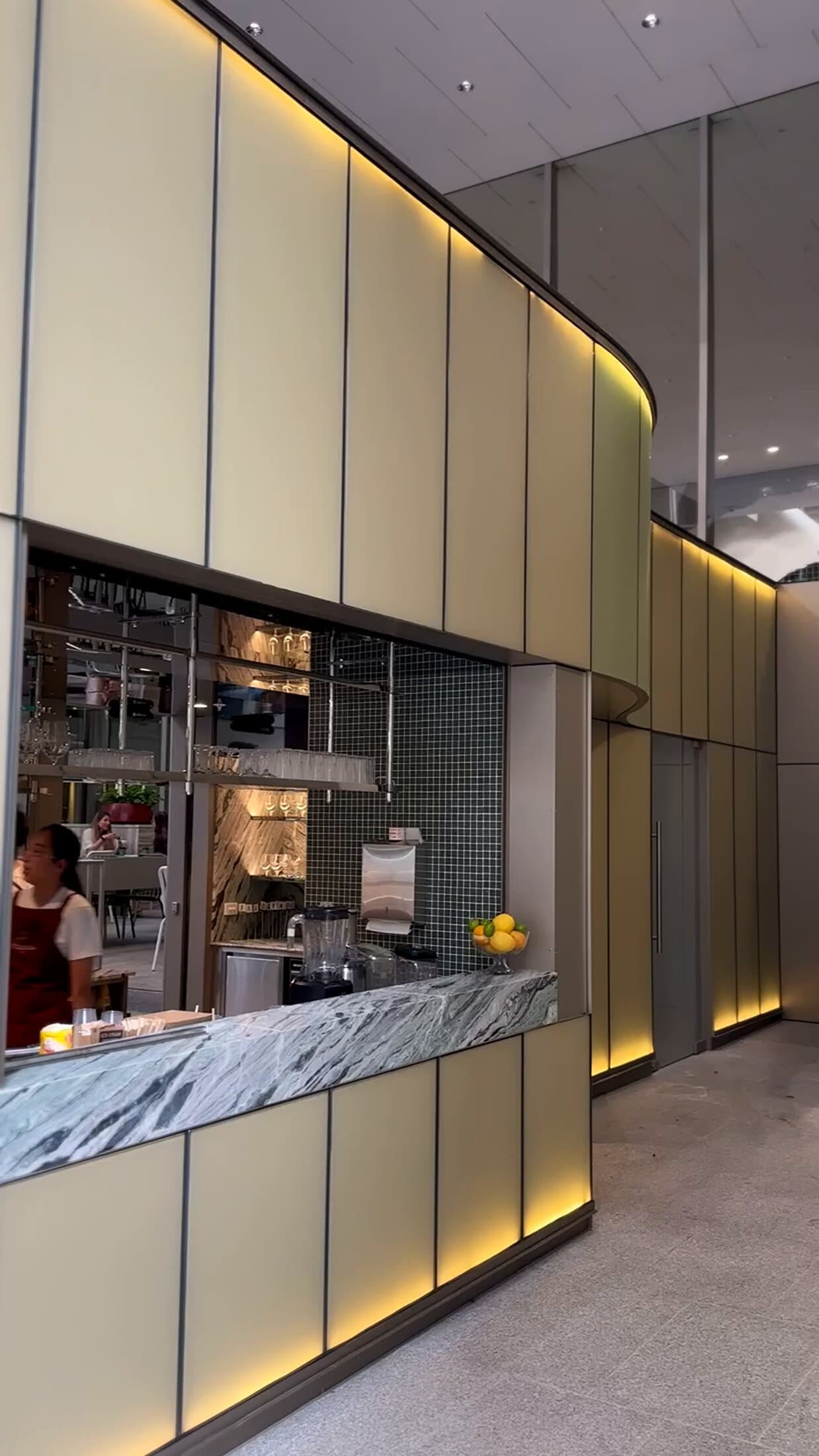 Completed bar counter with lit wall panels
