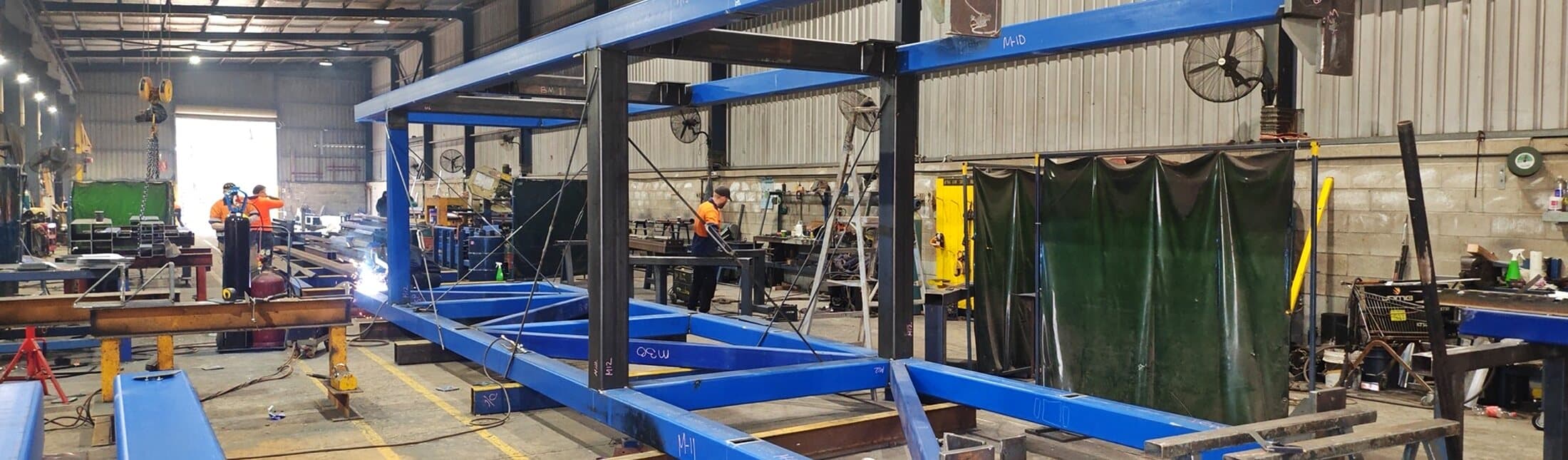 Lift shaft steel frame being welded and pre-assembled in the workshop