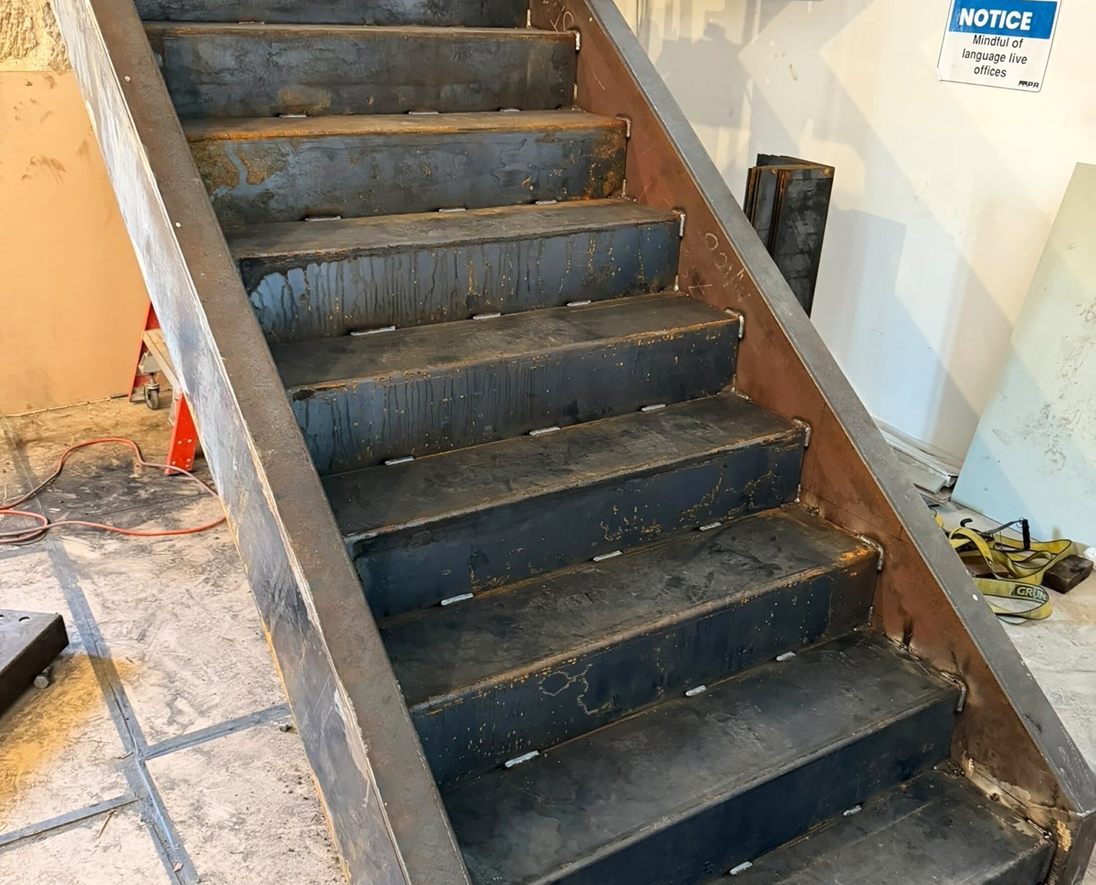 Fabricated steel stair installed between floors